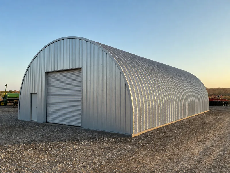 Arch Quonset metal building with doors confined to the flat end wall, showing how the curved sidewall limits openings and floor area